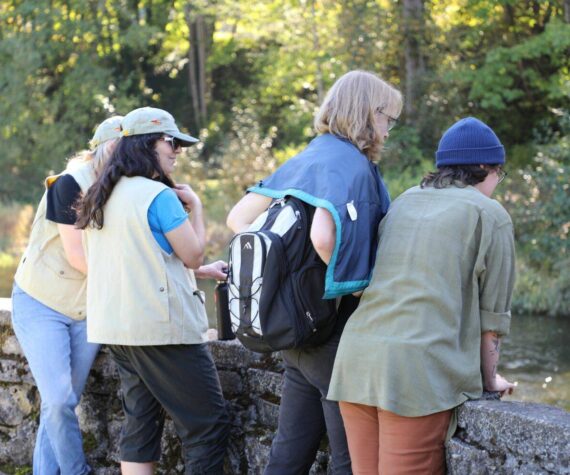 Volunteers educate community members about the returning Cedar River salmon. (Sound Publishing)