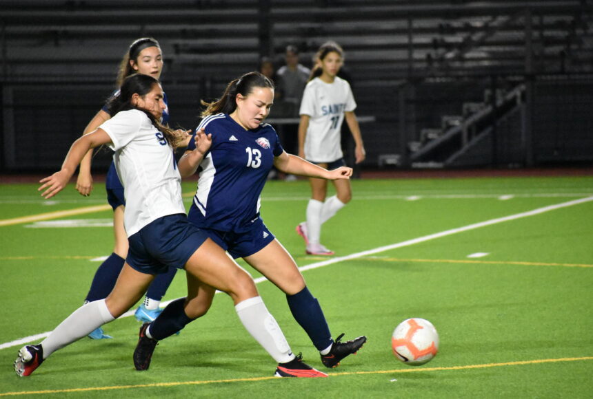 <p>Vivan Tran goes for the ball in a challenge against Interlake for Lindbergh. Ben Ray / The Reporter</p>