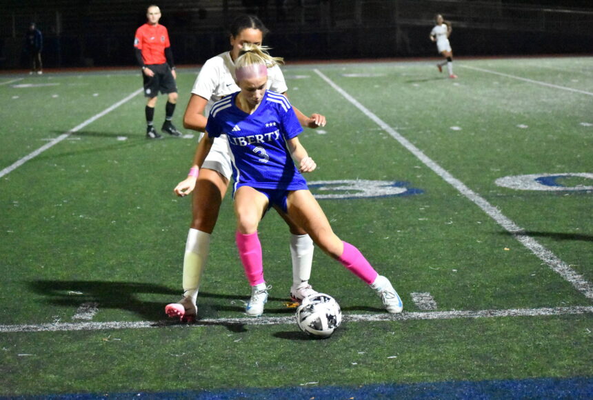 <p>Addie Streur with control of the ball against Bellevue. Ben Ray / The Reporter</p>