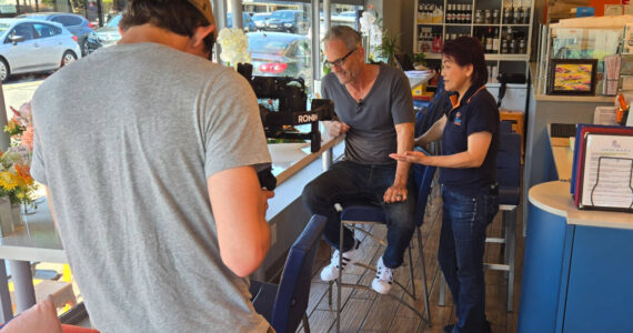 While filming the Issaquah Restaurant Spotlight series, Troy Kline tastes his favorite Thai dish at Sip Thai Zooom alongside restaurant owner Joon Likit.