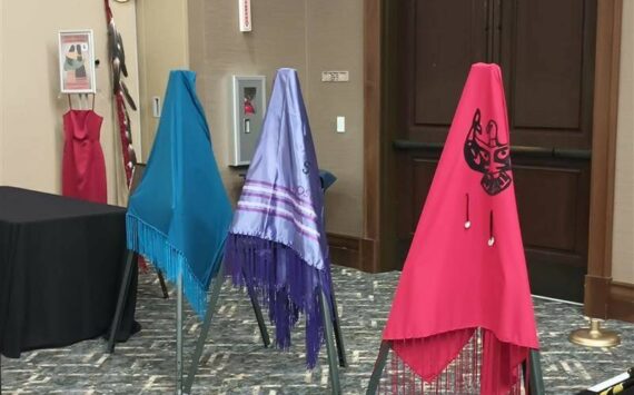 The Lummi Nation provided three colorful shawls during the MMIWP Task Force Summit in September, with turquoise representing human trafficking, purple representing overdoses (“losing our people from fentanyl”) and red representing murdered and missing Indigenous women — all crises that affect North American Natives and Tribes. The summit started with an opening ceremony with words from Lummi Tribal Chair Anthony Hillaire, Lummi Indian Business Council Secretary Lisa Wilson and a Shawl Ceremony with Lhaq’temish singers. Photo by Bailey Jo Josie/Sound Publishing