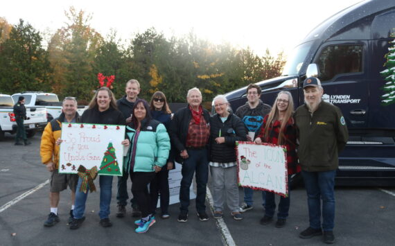 The Austin family arrived from all over Western Washington to greet Gene Austin, 89, (center) and John Schank (far right), the two drivers hauling the Christmas tree to Washington, D.C. Photo by Bailey Jo Josie/Sound Publishing.