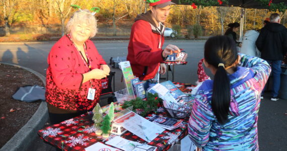 On Nov. 6, the city of Renton was the only Washington state stop on the 2024 U.S. Capitol Christmas Tree tour as an enormous Sitka spruce rolled into town, expertly parking at the Gene Coulon Boat Launch. Folks could also enjoy informational booths from the National Forest Service, Kenworth, Renton’s Parks and Recreation Department and various food trucks. (Photo by Bailey Jo Josie/Sound Publishing)