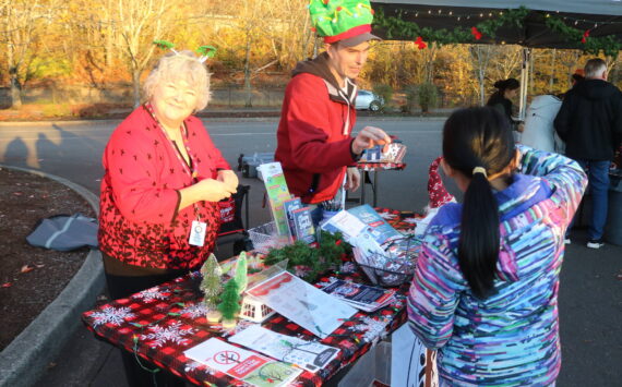 On Nov. 6, the city of Renton was the only Washington state stop on the 2024 U.S. Capitol Christmas Tree tour as an enormous Sitka spruce rolled into town, expertly parking at the Gene Coulon Boat Launch. Folks could also enjoy informational booths from the National Forest Service, Kenworth, Renton’s Parks and Recreation Department and various food trucks. (Photo by Bailey Jo Josie/Sound Publishing)