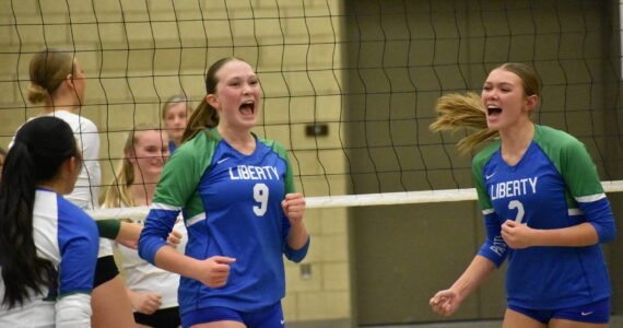 Maiya Lester and Hayden Quinto celebrate a point against Bishop Blanchet. Ben Ray / The Reporter