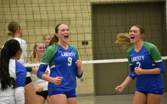 Maiya Lester and Hayden Quinto celebrate a point against Bishop Blanchet. Ben Ray / The Reporter