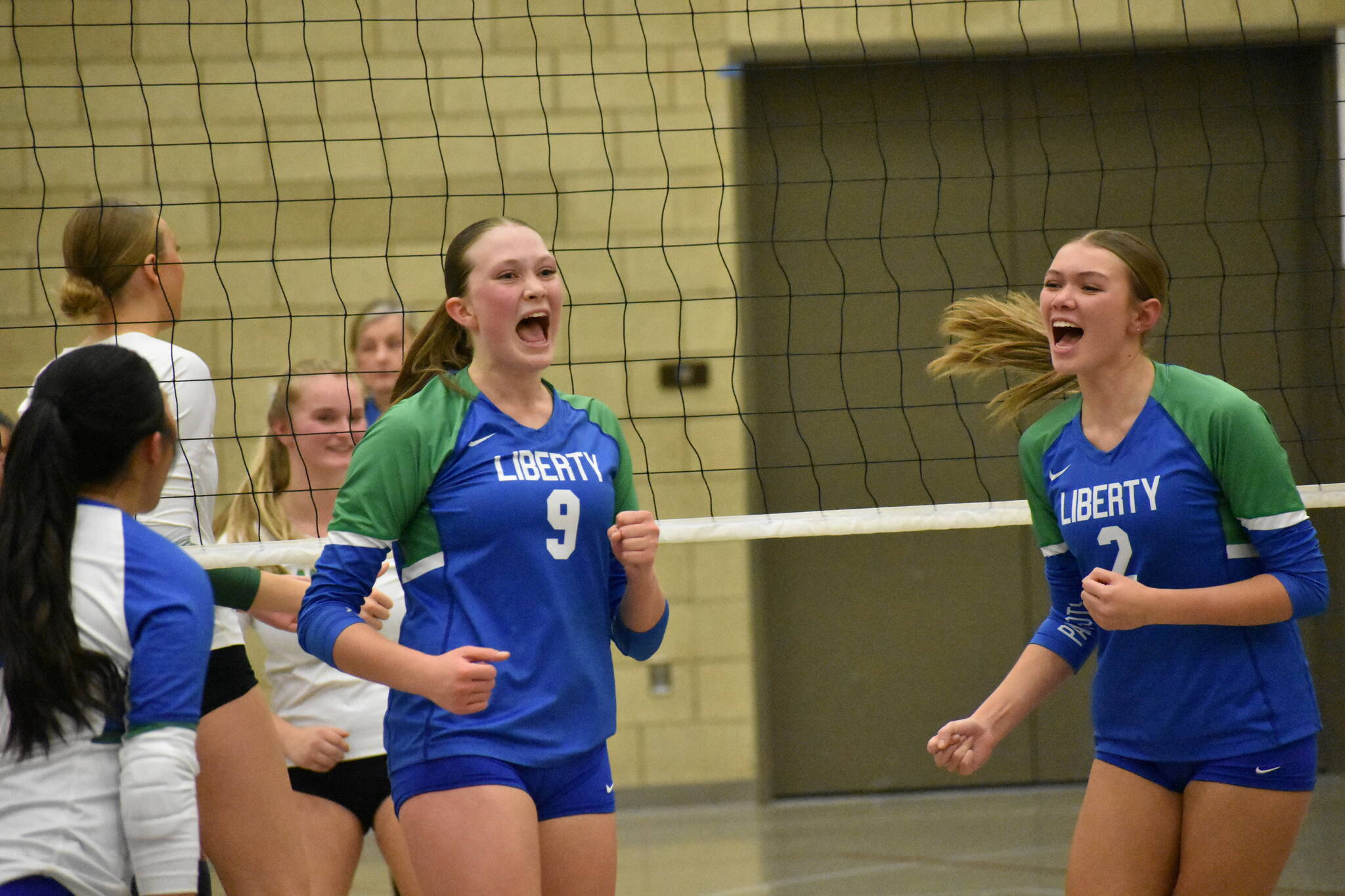 Maiya Lester and Hayden Quinto celebrate a point against Bishop Blanchet. Ben Ray / The Reporter