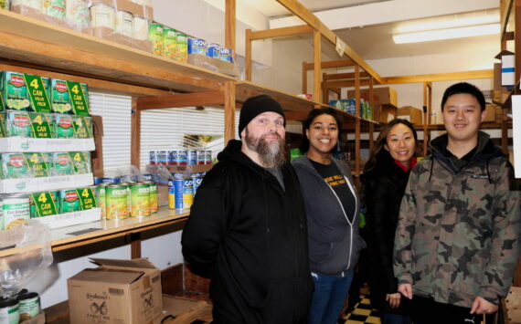 Jay West, Haley Boltz, Laura Kinzel and Kyle Wong are volunteers at Margie Williams Helping Hands Food Center, located at 4519 NE 10th Street in the Renton Highlands. Photo by Bailey Jo Josie/Sound Publishing