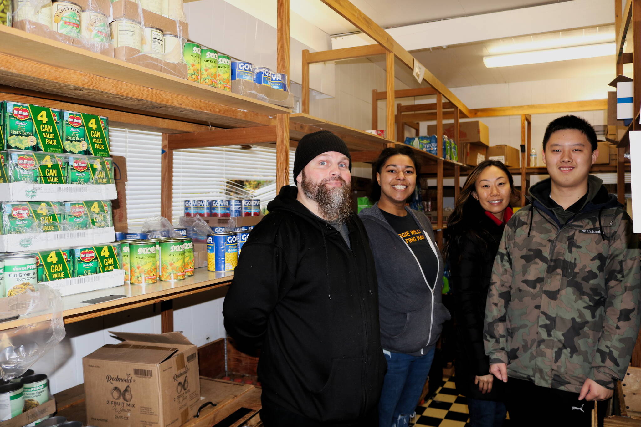 Jay West, Haley Boltz, Laura Kinzel and Kyle Wong are volunteers at Margie Williams Helping Hands Food Center, located at 4519 NE 10th Street in the Renton Highlands. Photo by Bailey Jo Josie/Sound Publishing