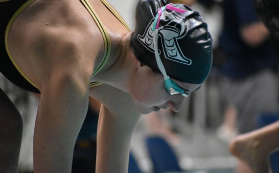 Sophie Buchan preps for her 200-freestyle race at state. Ben Ray / The Reporter