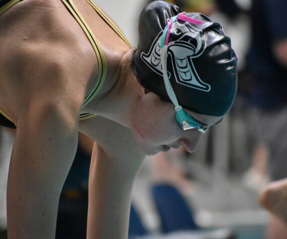 Sophie Buchan preps for her 200-freestyle race at state. Ben Ray / The Reporter