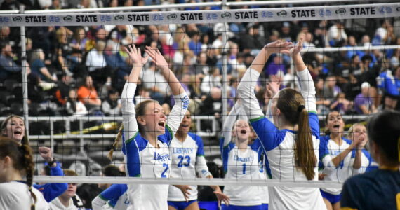 Hayden Quinto and Maiya Lester celebrate a point against West Seattle. Ben Ray / The Reporter