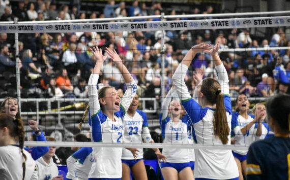 Hayden Quinto and Maiya Lester celebrate a point against West Seattle. Ben Ray / The Reporter