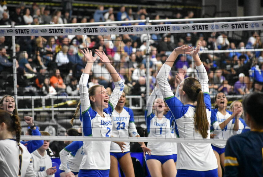 <p>Hayden Quinto and Maiya Lester celebrate a point against West Seattle. Ben Ray / The Reporter</p>