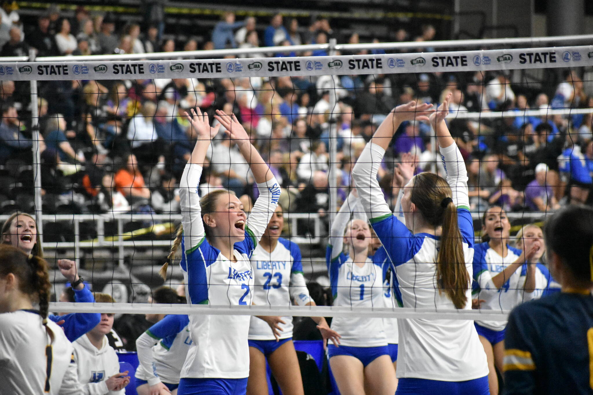 Hayden Quinto and Maiya Lester celebrate a point against West Seattle. Ben Ray / The Reporter