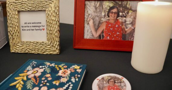 A photo of Kim Unti and a book to share memories of her at a celebrating her life. Photo by Joshua Solorzano/Renton Reporter