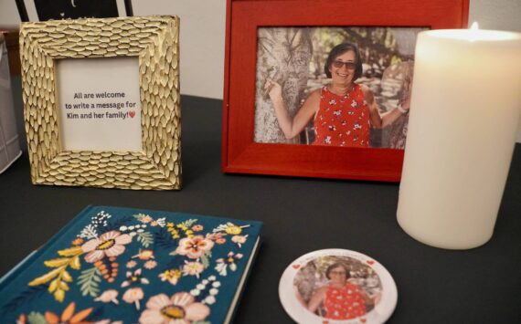 A photo of Kim Unti and a book to share memories of her at a celebrating her life. Photo by Joshua Solorzano/Renton Reporter