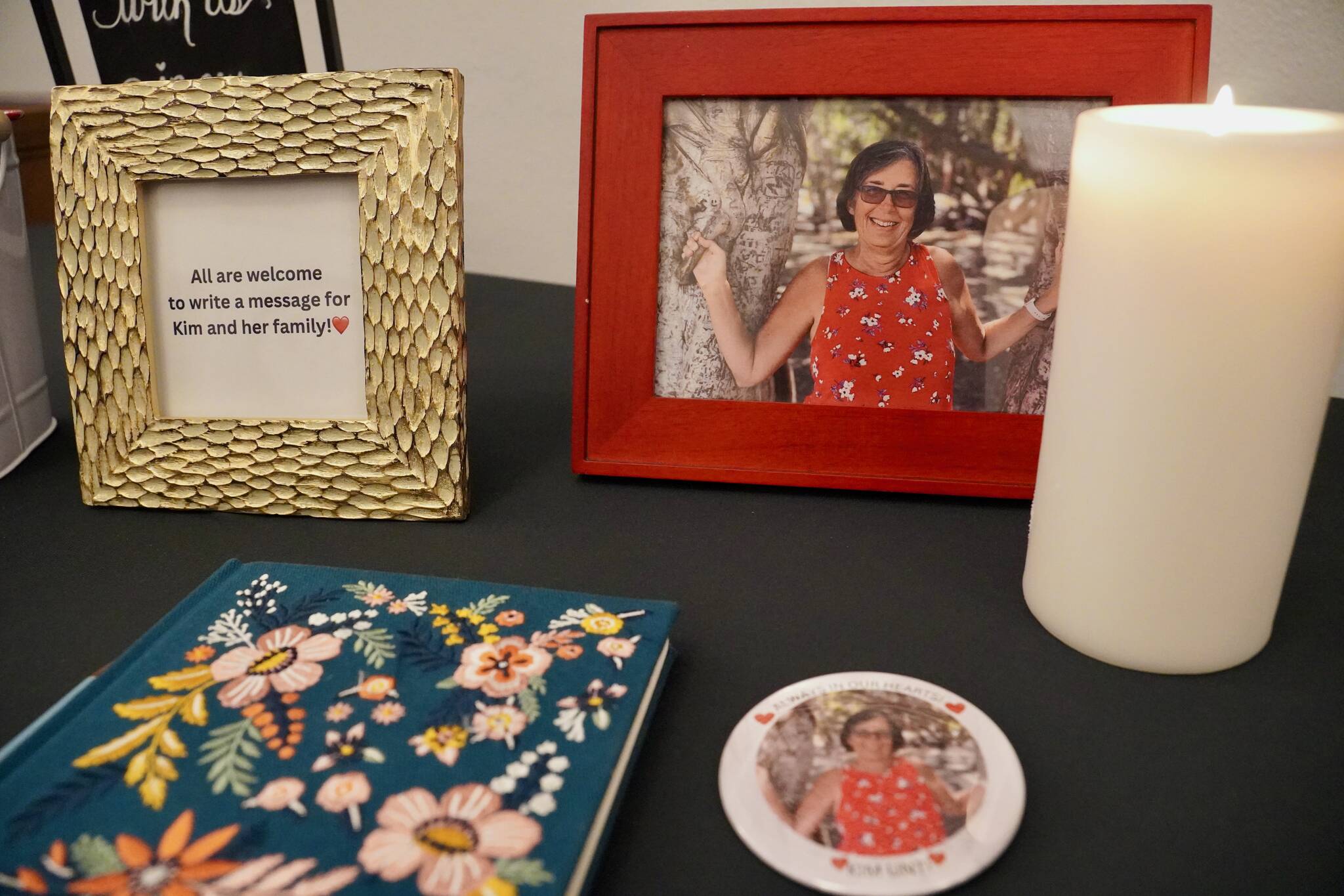 A photo of Kim Unti and a book to share memories of her at a celebrating her life. Photo by Joshua Solorzano/Renton Reporter