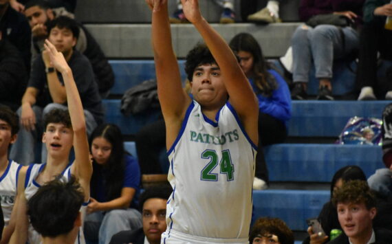 Sophomore Tyson Burley shoots a three point shot. Ben Ray / The Reporter