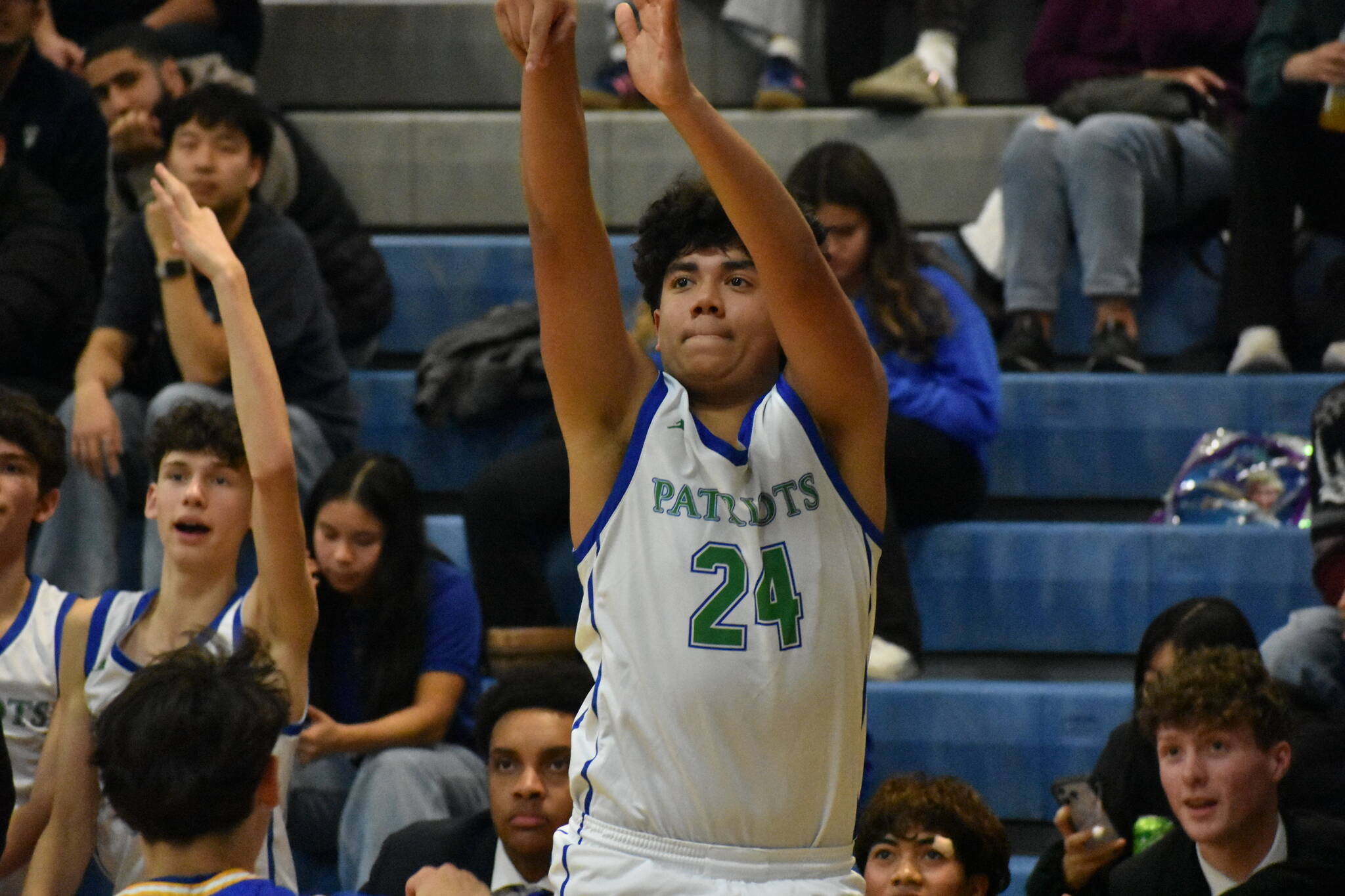 Sophomore Tyson Burley shoots a three point shot. Ben Ray / The Reporter