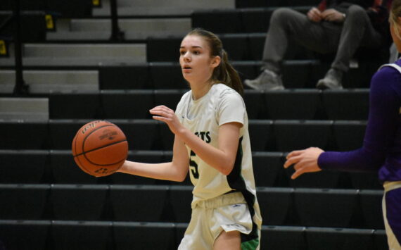 Chelsea Irvine looks for a player to pass the ball to against North Thurston. Ben Ray / The Reporter