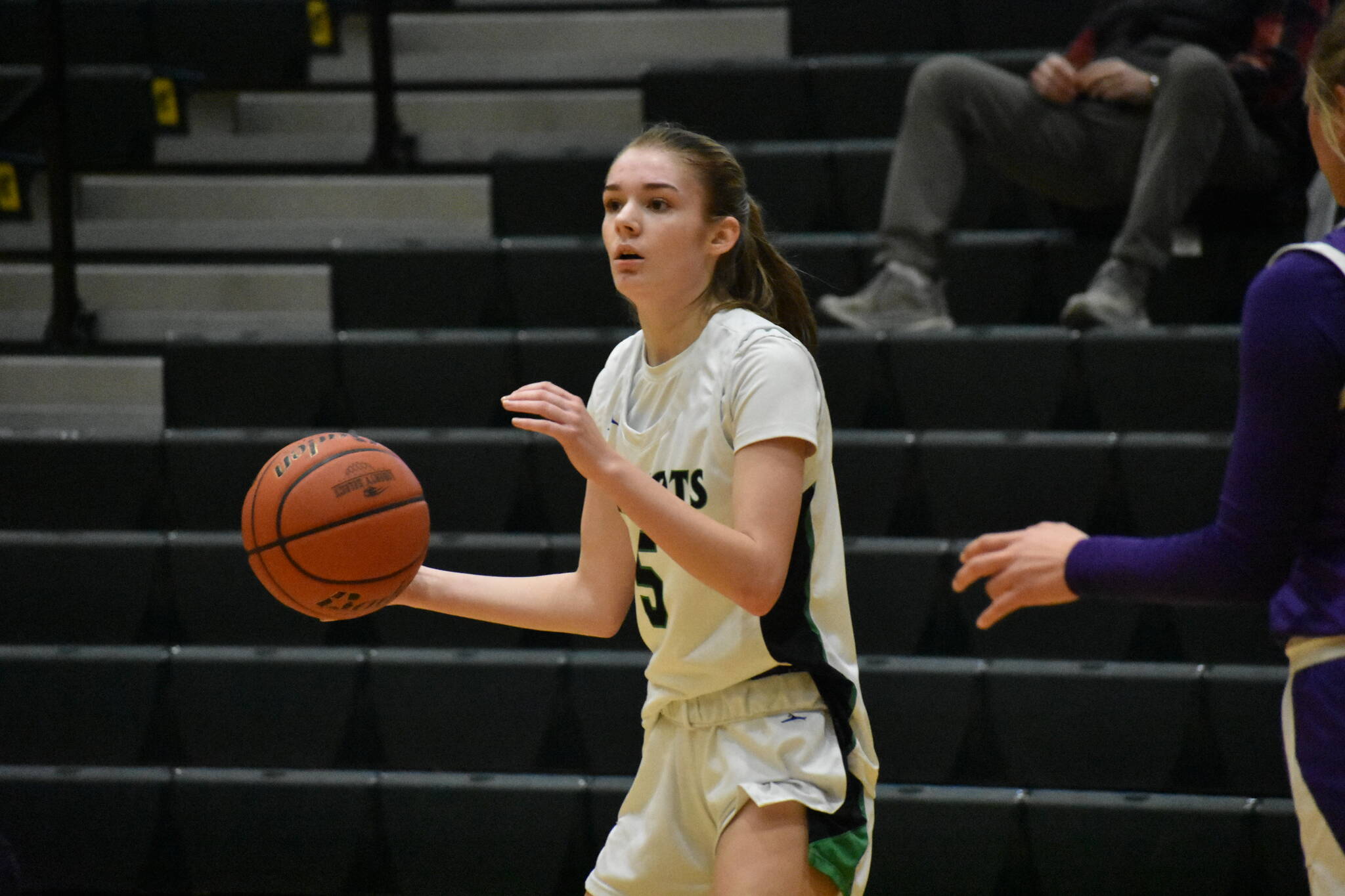 Chelsea Irvine looks for a player to pass the ball to against North Thurston. Ben Ray / The Reporter