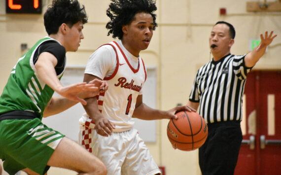 Ben Ray / The Reporter
Renton’s Jordan Agosto fends off a Woodinville defender.