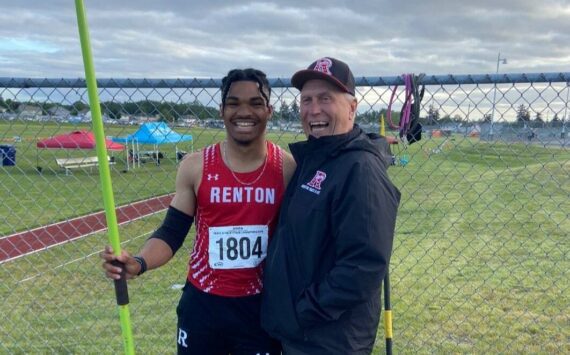 Demond Williams Jr. and Keith Eager after Williams won javelin at the state tournament. Courtesy photo.