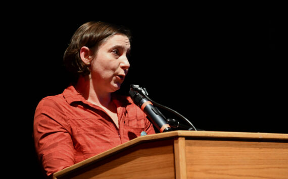 Julianna Dauble of the Renton Education Association addresses the crowd at the “School Funding Crisis” Eastside Town Hall on Jan. 8 at Sammamish High School in Bellevue. File photo