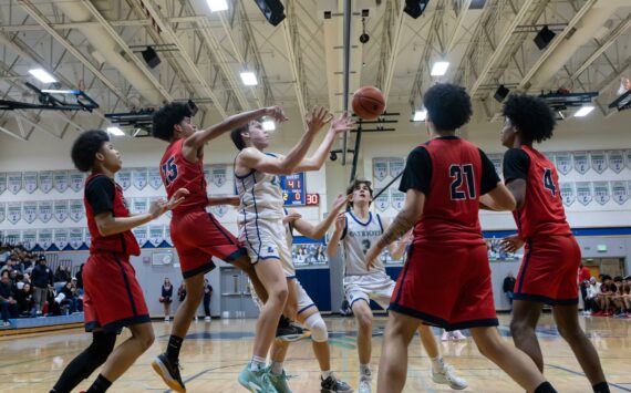 Isaac Roberts reaches for a pass against Silas. Photo taken by Maria Dorsten.