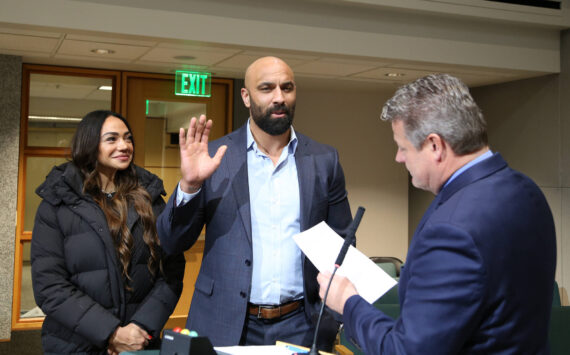 Councilmember Reagan Dunn swears in former NFL player and Renton native Mkristo E. Bruce to the King County Fire Protection District No. 47 Board of Commissioners. Bruce was unanimously appointed to the position on Tuesday, February 25, 2025. Photo provided by David Shurtleff.