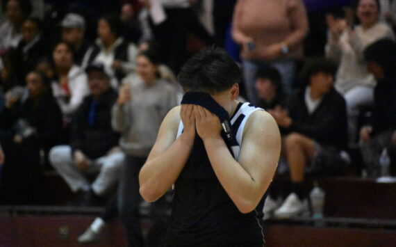 Trinidad Valentino English covers his face after falling to Sequim in the state tournament. Ben Ray / The Reporter